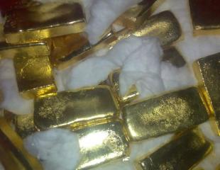 Gold powder and ingots.
