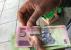 -Le Zimbabwe en crise interdit les transactions en devises étrangères sur son sol
